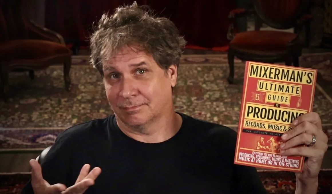 Mixerman holding a copy of his book, Mixerman's Ultimate Guide to Producing Records, Music & Songs